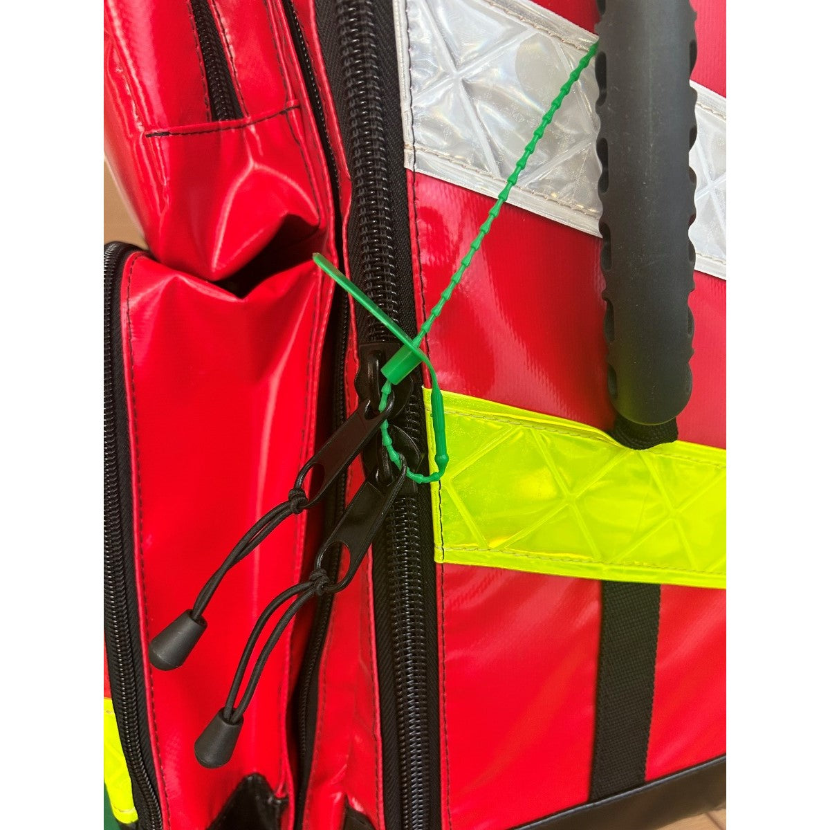 Versapak VersaLite+ Plastic Pull Tight Seal (Plain) in Action on Emergency Services Bag